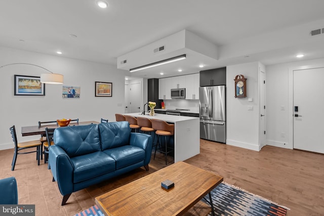 1501 N 31st St Unit 318, Philadelphia, PA 19121 - living room featuring visible vents, recessed lighting, and light wood-style floors
