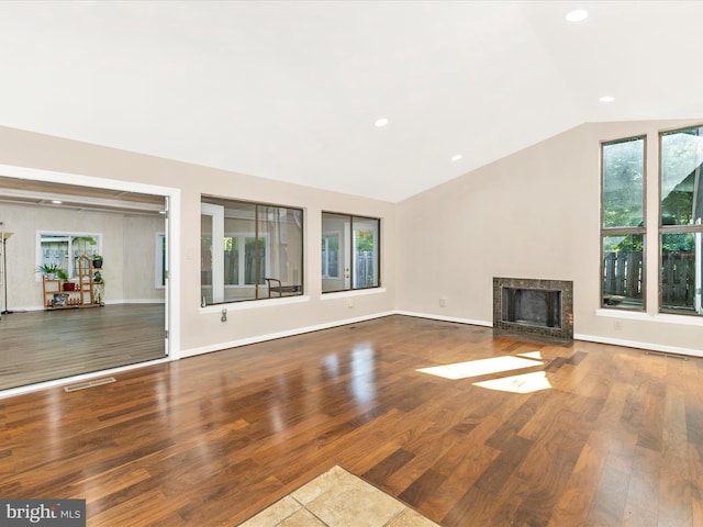 19512 Desmet Pl, Montgomery Village, MD 20886 - unfurnished living room featuring wood finished floors, lofted ceiling, a fireplace, recessed lighting, and baseboards