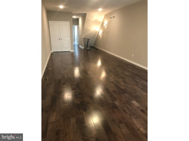 1315 N 6th St, Philadelphia, PA 19122 - unfurnished living room with dark wood-type flooring, visible vents, and baseboards