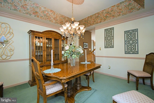 dining space featuring a chandelier, baseboards, and carpet