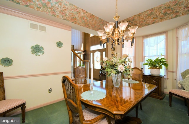 dining room featuring visible vents, a chandelier, carpet flooring, wallpapered walls, and baseboards