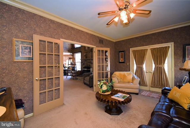 living area featuring crown molding, french doors, carpet floors, and wallpapered walls