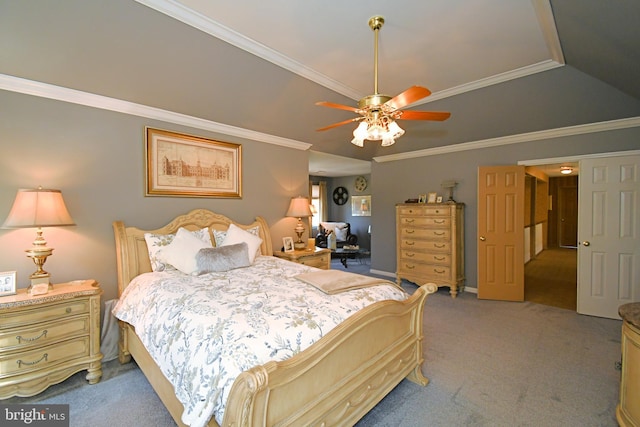 bedroom featuring vaulted ceiling, light carpet, crown molding, a ceiling fan, and a tray ceiling