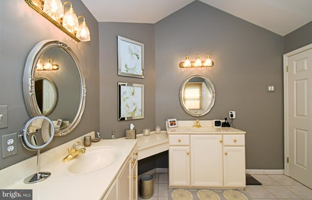 full bath featuring tile patterned floors, vanity, baseboards, and lofted ceiling
