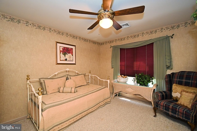bedroom featuring a ceiling fan, visible vents, and carpet floors