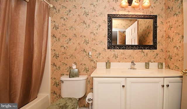 bathroom featuring shower / bath combo, vanity, wallpapered walls, and toilet