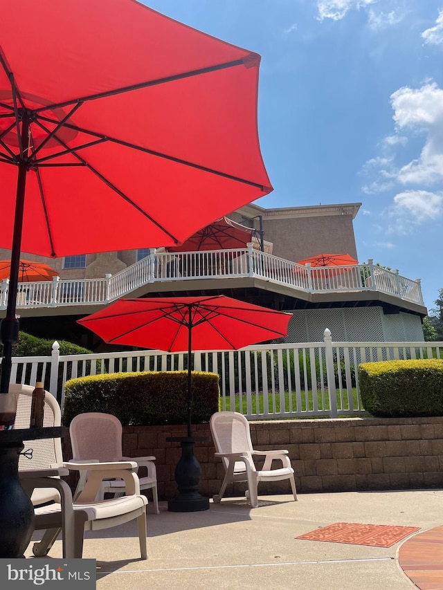 view of patio featuring fence