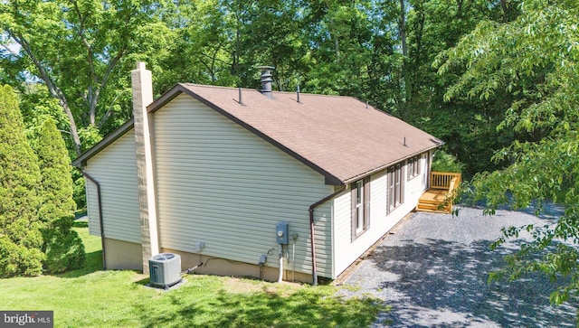 804 Farms River Rd, Front Royal, VA 22630 - view of property exterior featuring central air condition unit, a wooden deck, a chimney, a yard, and roof with shingles