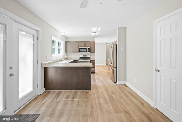 804 Farms River Rd, Front Royal, VA 22630 - kitchen featuring stainless steel appliances, a peninsula, light wood finished floors, light countertops, and ceiling fan