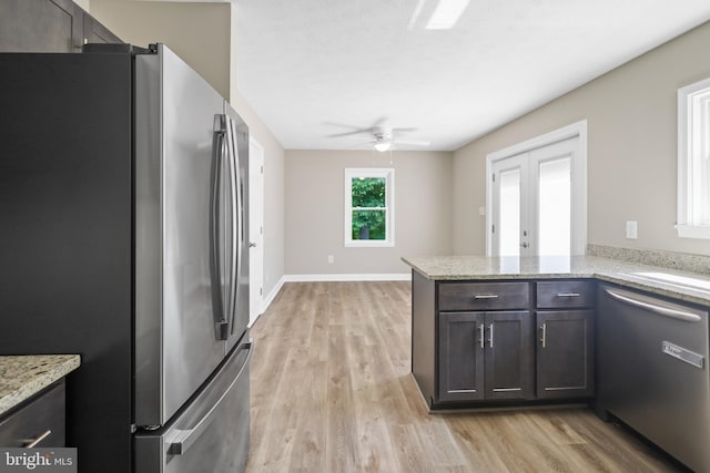 804 Farms River Rd, Front Royal, VA 22630 - kitchen with appliances with stainless steel finishes, ceiling fan, light wood finished floors, light stone counters, and a peninsula