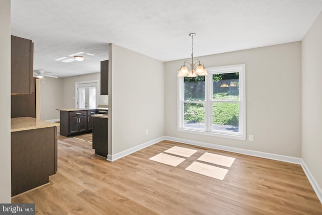804 Farms River Rd, Front Royal, VA 22630 - unfurnished dining area featuring baseboards, light wood finished floors, and a chandelier