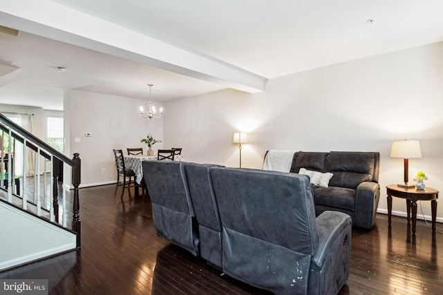 living room featuring baseboards, a chandelier, stairs, beamed ceiling, and dark wood finished floors