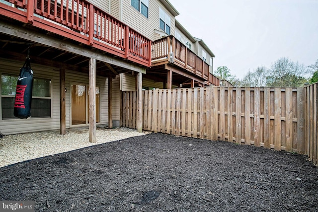 view of yard featuring a fenced backyard and a wooden deck
