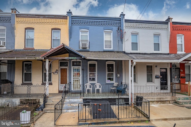 4990 W Thompson St, Philadelphia, PA 19131 - multi unit property featuring brick siding, a porch, and a gate