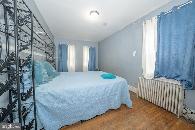4990 W Thompson St, Philadelphia, PA 19131 - bedroom with hardwood / wood-style floors and radiator