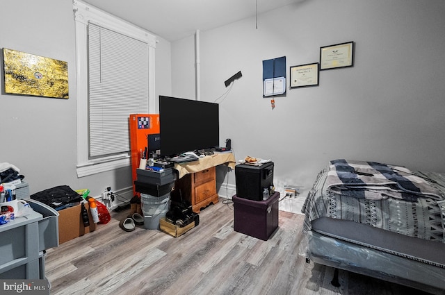 bedroom featuring wood finished floors