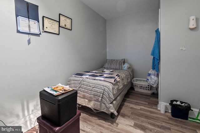 bedroom featuring wood finished floors