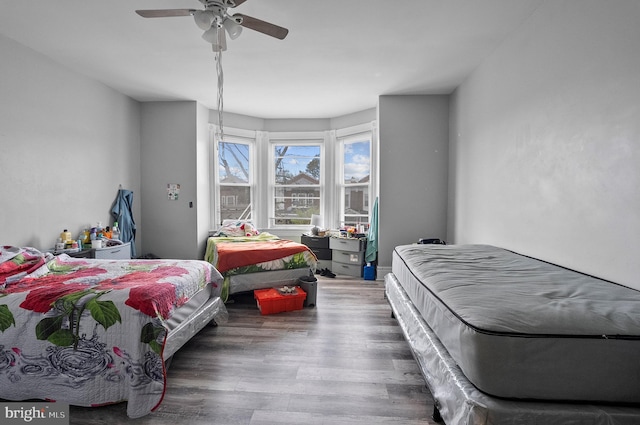 bedroom featuring wood finished floors and ceiling fan