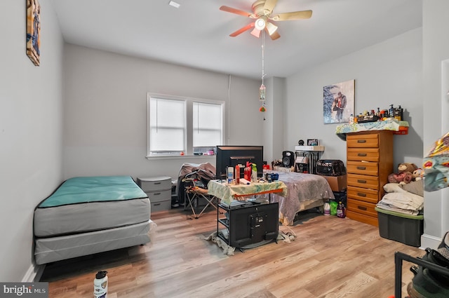bedroom with ceiling fan and wood finished floors