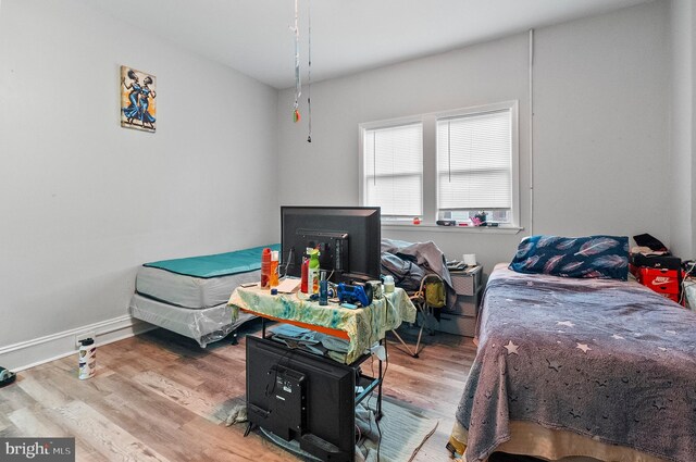 bedroom with wood finished floors