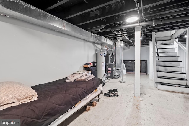 basement with gas water heater, heating unit, and stairs