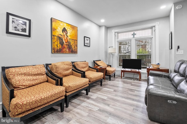 living area featuring recessed lighting and light wood-type flooring