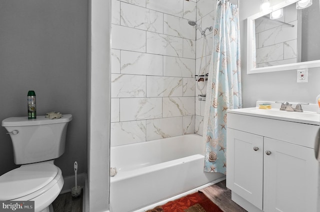 full bathroom featuring toilet, shower / tub combo, wood finished floors, and vanity
