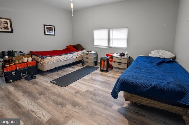 bedroom featuring wood finished floors