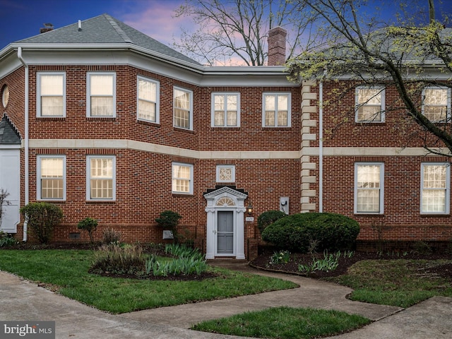 1324 Ramseur Ln, Winchester, VA 22601 - view of front of home with a chimney, brick siding, and crawl space