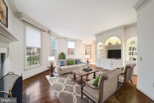 1324 Ramseur Ln, Winchester, VA 22601 - living area with baseboards, ornamental molding, built in features, and hardwood / wood-style floors