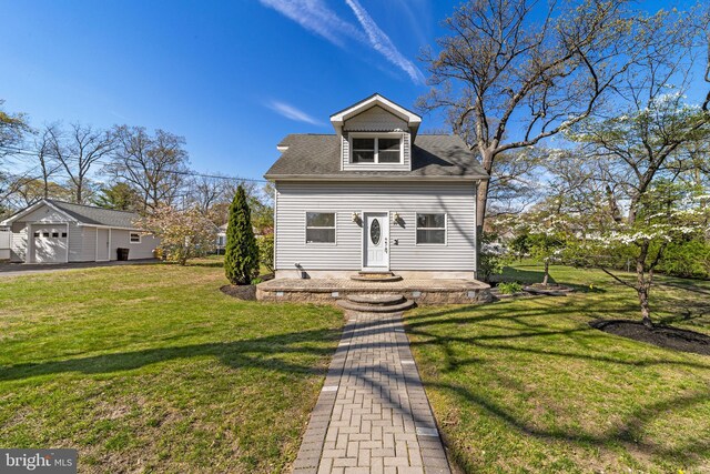 view of front of home with a shingled roof, a front lawn, and a garage