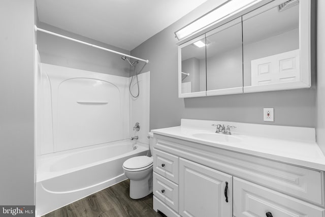 full bathroom with shower / tub combination, vanity, toilet, visible vents, and wood finished floors