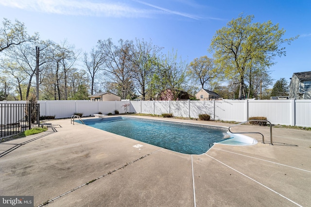 view of pool with a fenced in pool, a fenced backyard, and a patio area