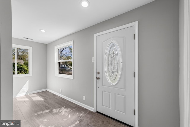 entrance foyer featuring recessed lighting, visible vents, and baseboards