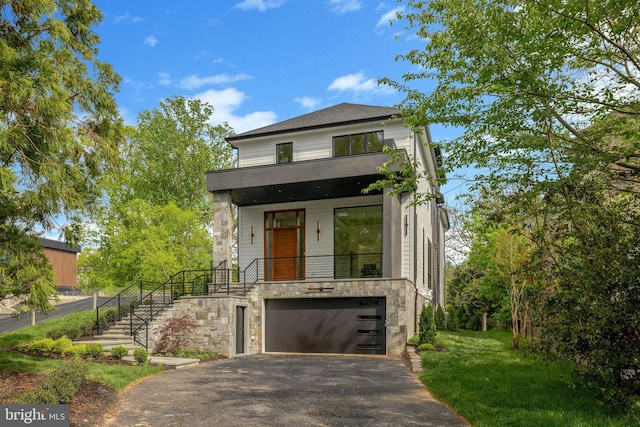 1853 Massachusetts Ave, Mclean, VA 22101 - contemporary home featuring stairs, stone siding, asphalt driveway, and an attached garage