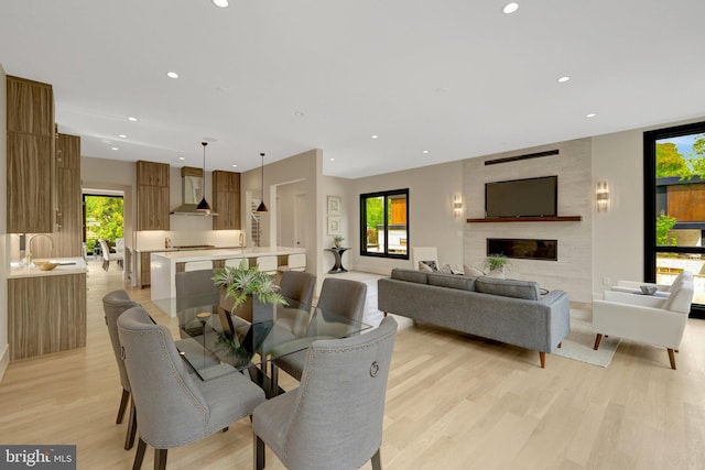 1853 Massachusetts Ave, Mclean, VA 22101 - dining area featuring light wood-style floors, recessed lighting, and a large fireplace