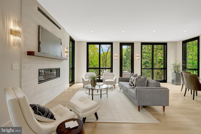 1853 Massachusetts Ave, Mclean, VA 22101 - living area featuring a premium fireplace, light wood finished floors, and recessed lighting