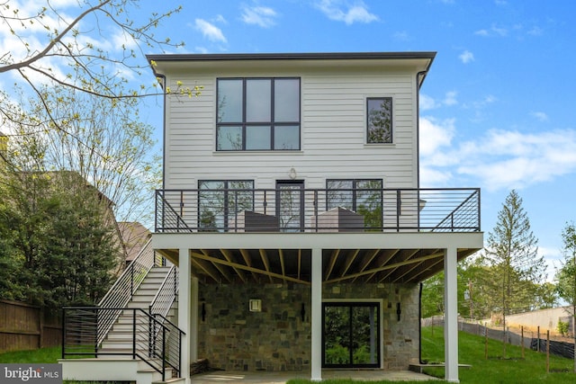 1853 Massachusetts Ave, Mclean, VA 22101 - back of house featuring stairs, a balcony, and stone siding