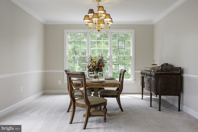 dining space featuring a chandelier, light carpet, baseboards, and ornamental molding