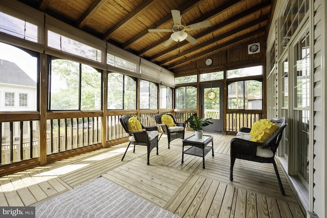 sunroom / solarium featuring ceiling fan and outdoor lounge area