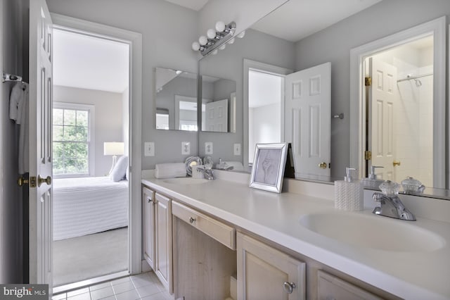 full bath with double vanity, tile patterned flooring, and a shower