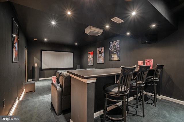 home theater room featuring baseboards, a dry bar, carpet floors, and recessed lighting