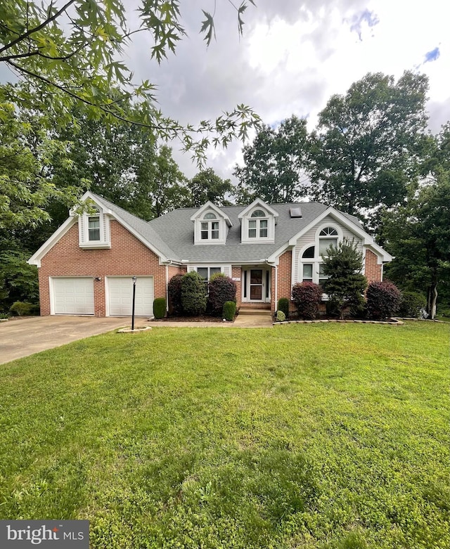 10907 Park Ridge Rd, Fredericksburg, VA 22408 - cape cod house featuring brick siding, concrete driveway, and a front yard