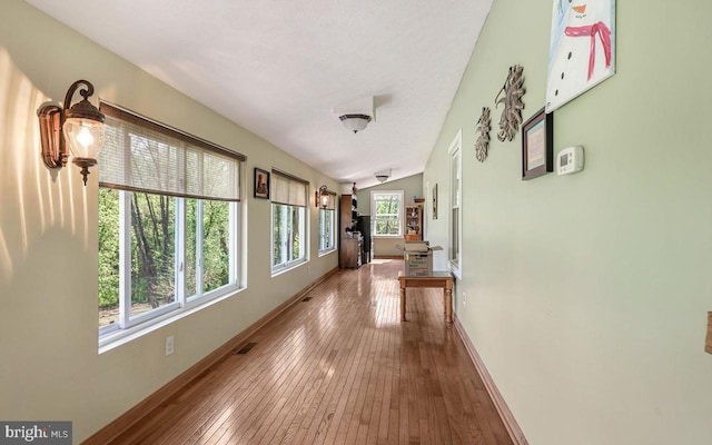 212 Mowry Ln, Edinburg, VA 22824 - hallway with baseboards, hardwood / wood-style flooring, and visible vents