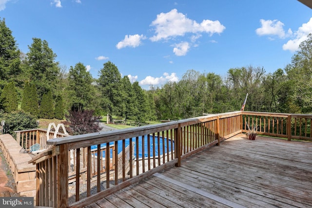212 Mowry Ln, Edinburg, VA 22824 - wooden terrace featuring an outdoor pool