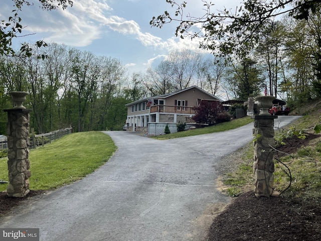 212 Mowry Ln, Edinburg, VA 22824 - view of front of home with a front lawn, fence, and driveway