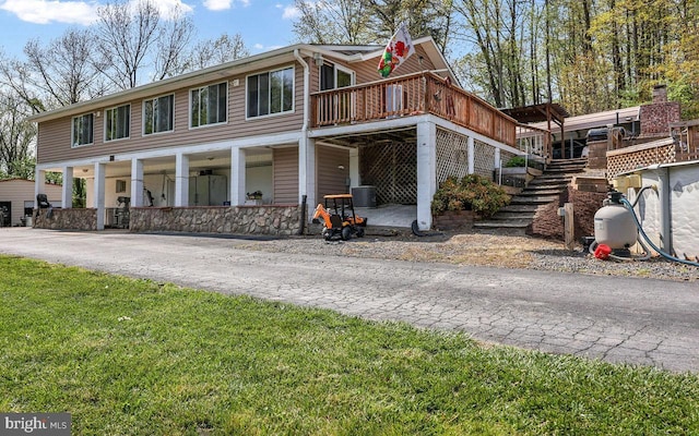 212 Mowry Ln, Edinburg, VA 22824 - view of front of home featuring stairs and a front lawn