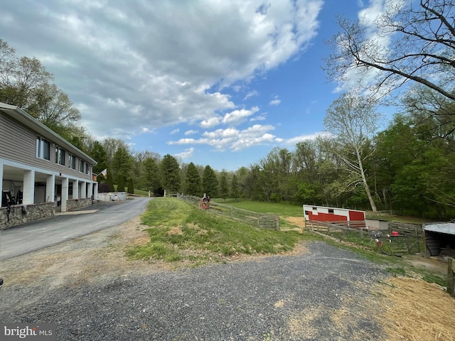212 Mowry Ln, Edinburg, VA 22824 - view of road with driveway and a wooded view
