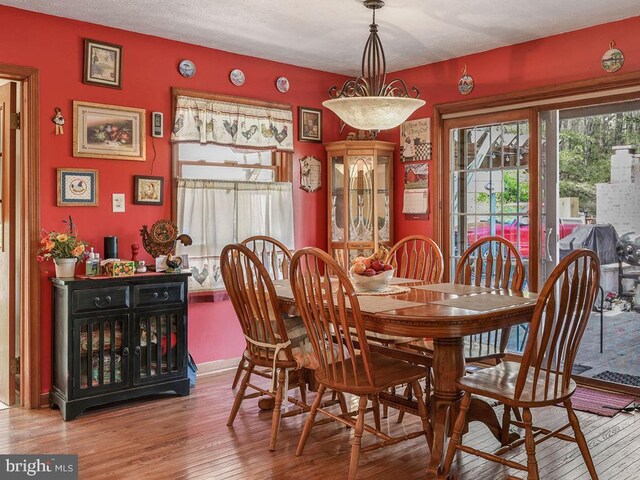 212 Mowry Ln, Edinburg, VA 22824 - dining space with baseboards and hardwood / wood-style floors