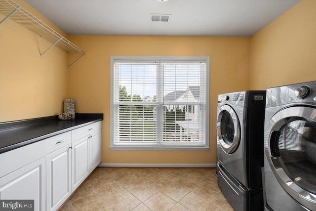 7135 Hills Ln, Warrenton, VA 20187 - laundry area featuring washing machine and dryer, baseboards, cabinet space, and light tile patterned floors